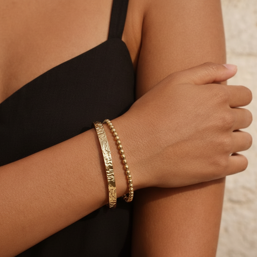 SOLARA Gold Bracelet worn on wrist, polished 18K gold PVD bead bracelet with sliding clasp – CCaura