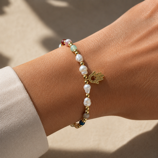 Hamsa Pearl Bracelet worn on wrist, freshwater pearl and natural gemstone bracelet with gold Hamsa charm – CCaura