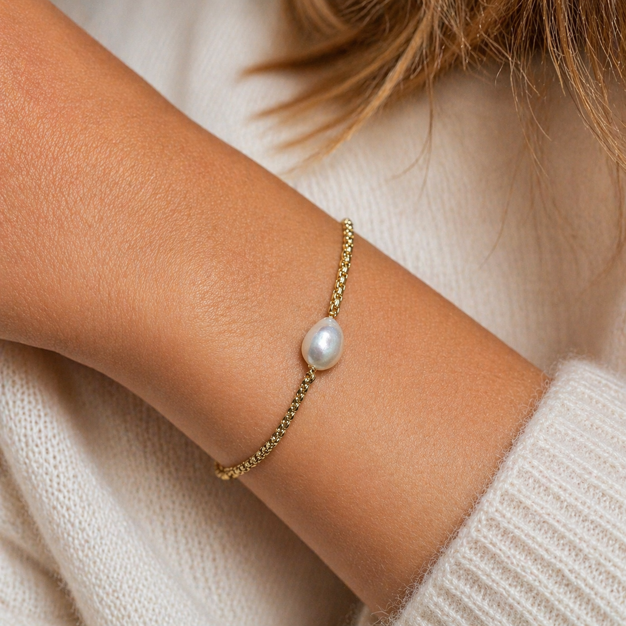 HESTIA Pearl Bracelet worn on wrist alone  by model natural freshwater pearl centre soft 18k Gold PVD bracelet by CCaura