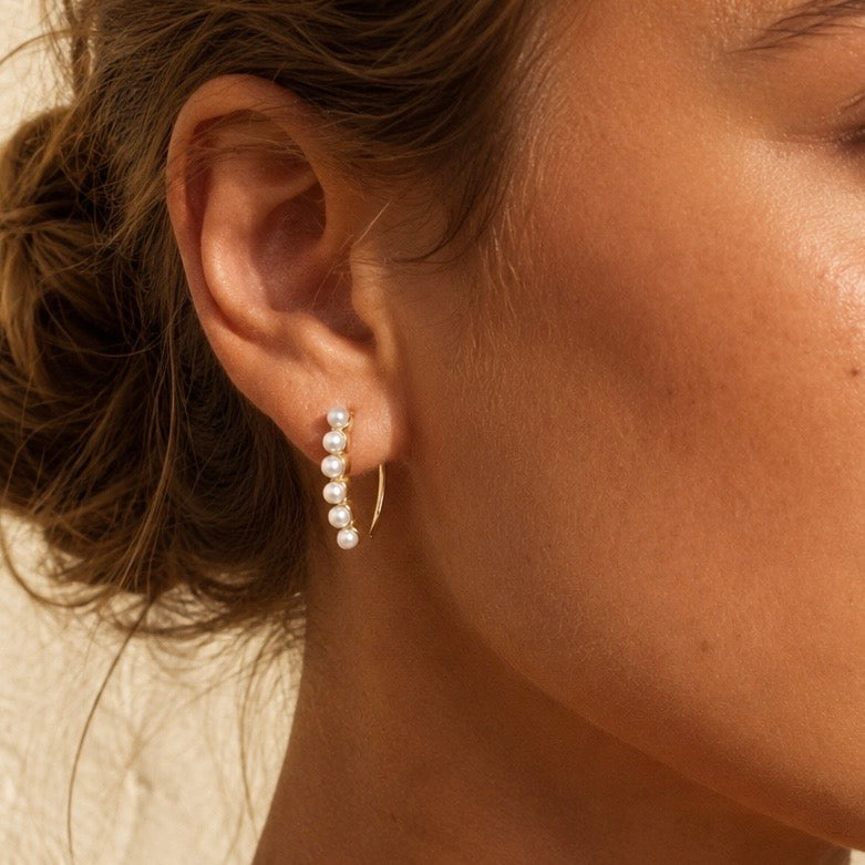 ELYSIAN PEARL HUGGIES gold earrings CCaura white background