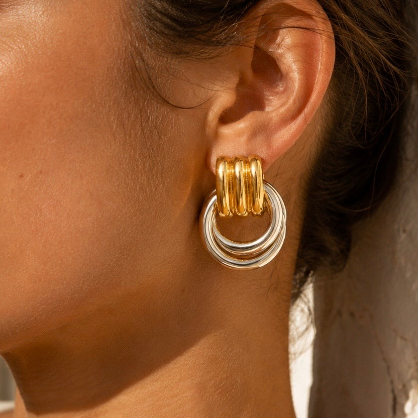 MILA TWO-TONE HOOPS, Gold plated and silver interlocking multi-ring door knocker earrings, worn by model, CCAura