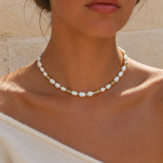 ISLA PEARL NECKLACE styled at the collarbone worn by model — CCaura