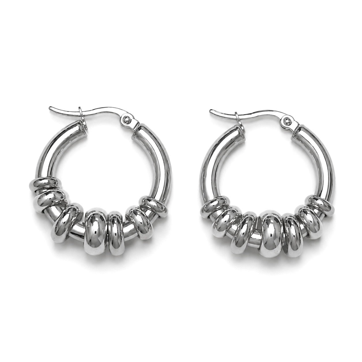 OASIS Silver Hoops worn by model out doors – CCaura