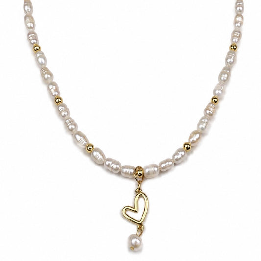 CELESTE PEARL HEART NECKLACE - 18K Gold PVD beads and natural freshwater pearls necklace with a hanging gold heart charm that ends with a pearl drop, on white background. CCAura