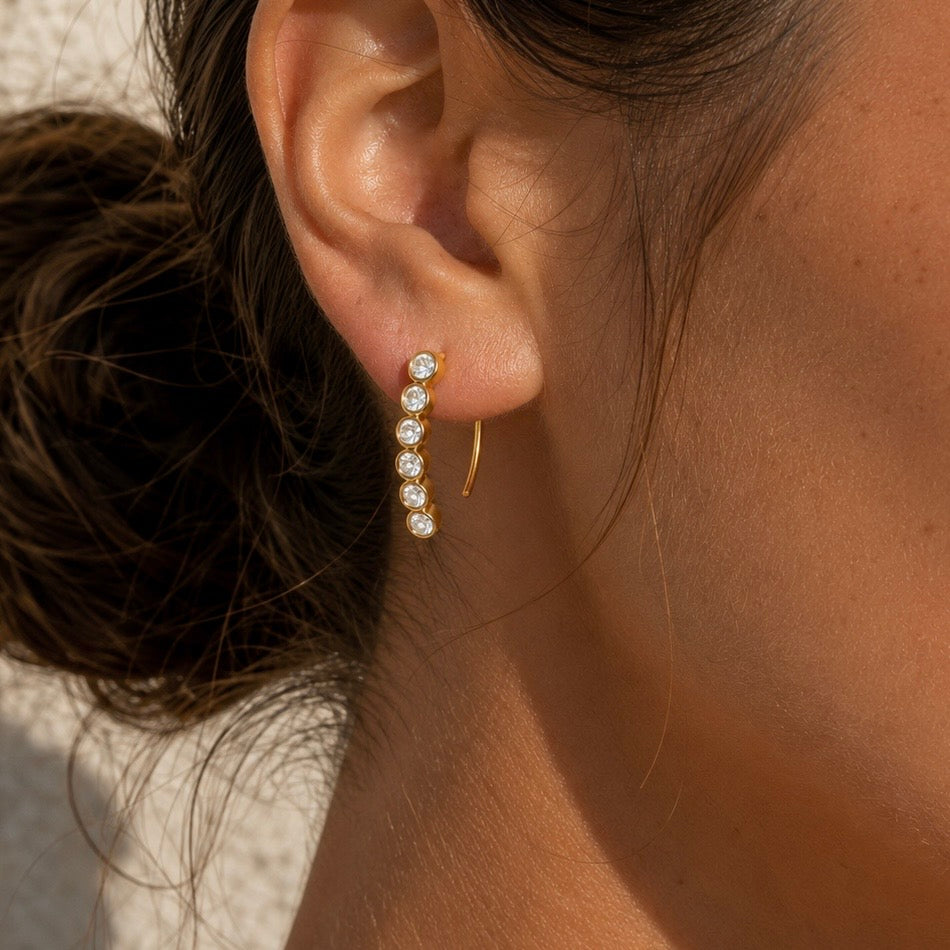 ELYSIAN CRYSTAL HUGGIES gold earrings CCaura white background