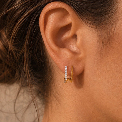 RADIANT LINK MINI HOOPS, double-bar 18K Gold PVD mini hoop earrings with crystal pavé, worn by model, CCAura
