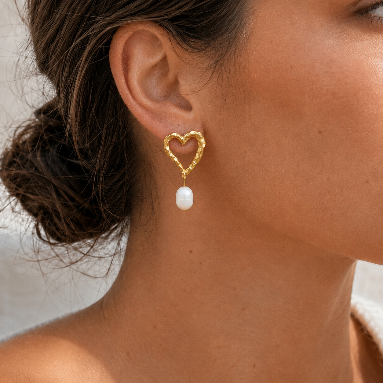 HERA PEARL HEART EARRINGS, hammered 18K gold  PVD heart drop earrings with freshwater pearl, worn by model, CCAura
