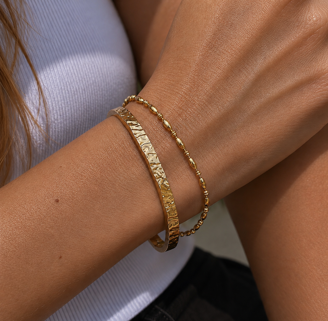 LUCIA Gold Bead Bracelet worn on wrist, delicate polished gold bead bracelet  layered on model
wrist by CCAURA