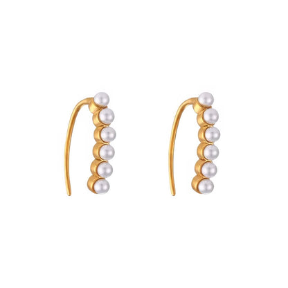 ELYSIAN PEARL HUGGIES gold earrings CCaura white background