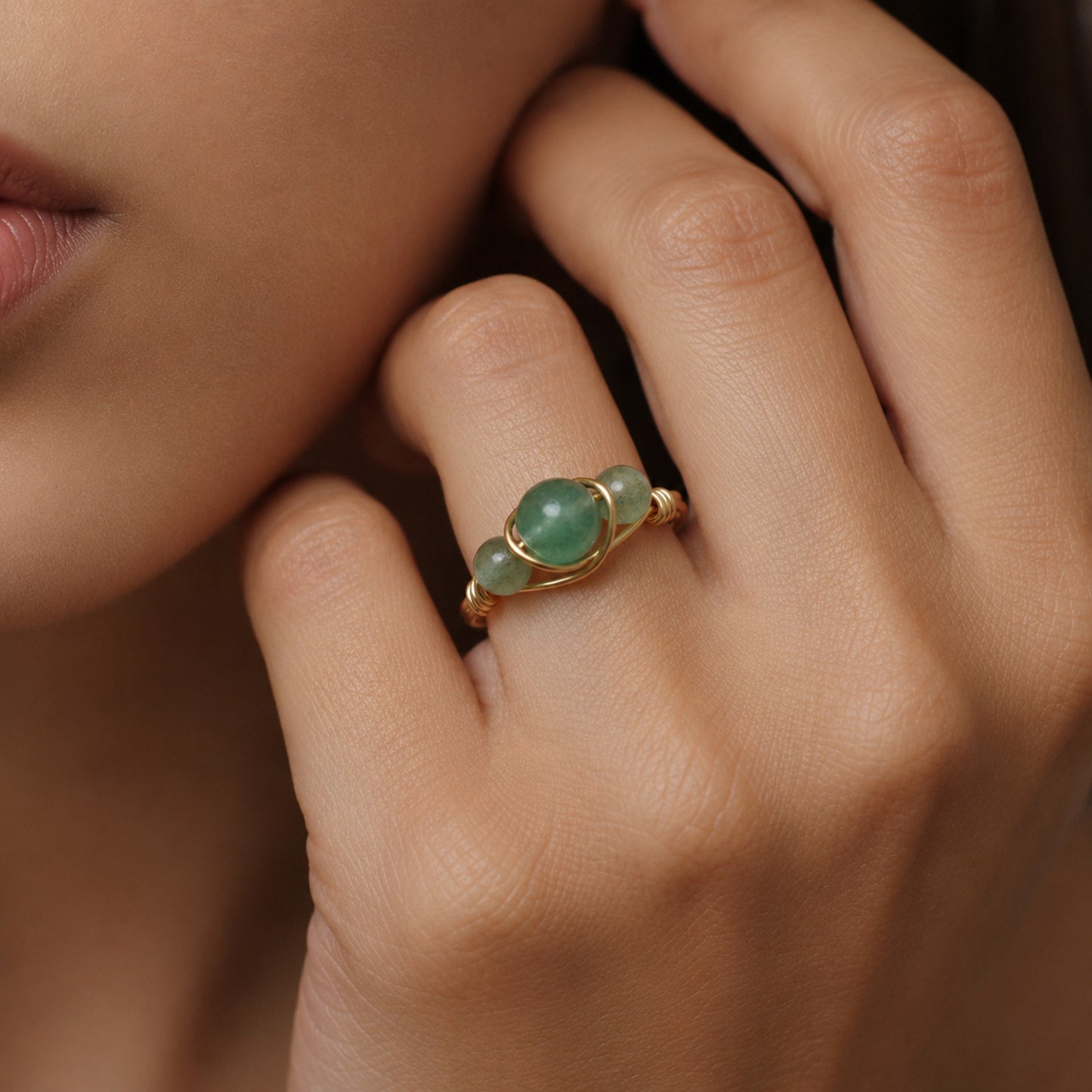 Jade Halo Gold Ring on model's finger against a neutral background- CCAURA